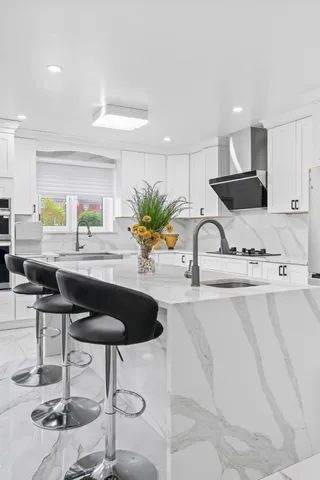 a kitchen with cabinets and appliances