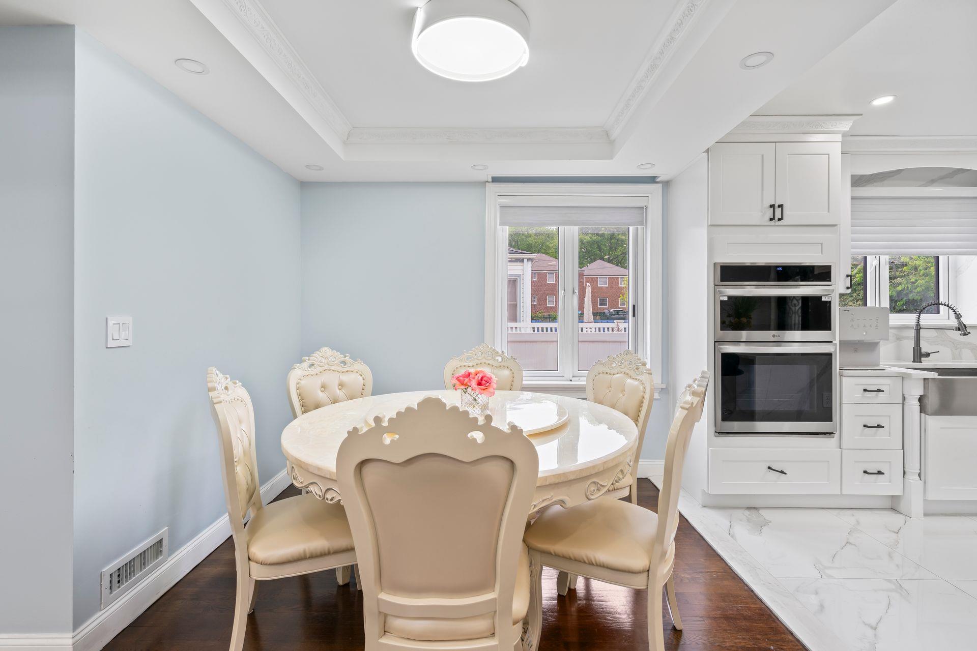 63-41 252nd Street Queens, NY 11362 - Photo 17 of 39 a view of a dining room with furniture and wooden floor