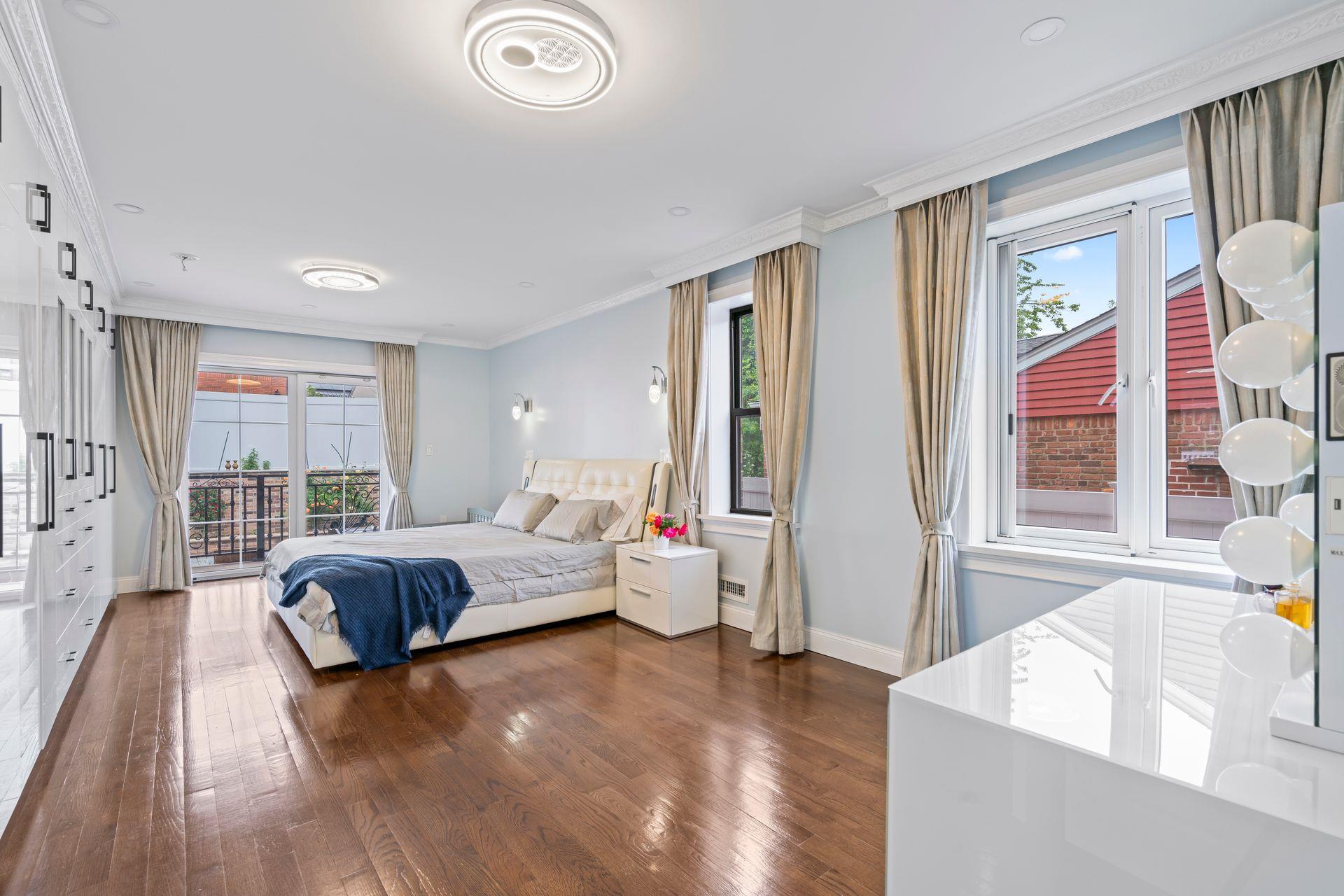 63-41 252nd Street Queens, NY 11362 - Photo 20 of 39 a living room with furniture and a large window