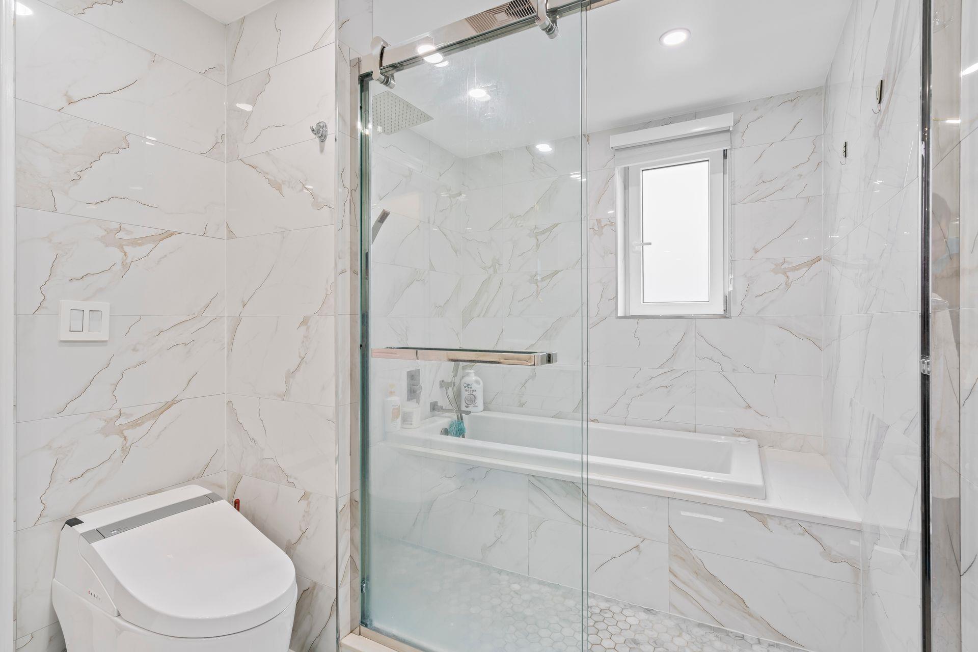 63-41 252nd Street Queens, NY 11362 - Photo 22 of 39 a bathroom with a toilet and a shower