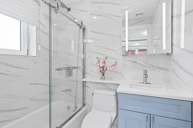 a bathroom with a sink and a shower