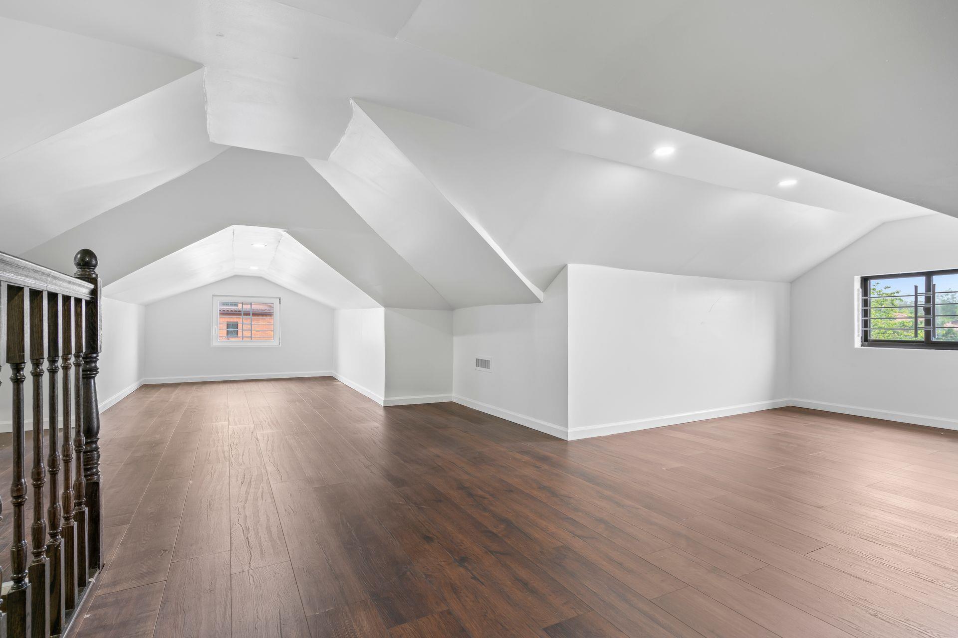 63-41 252nd Street Queens, NY 11362 - Photo 29 of 39 a view of a hallway with wooden floor