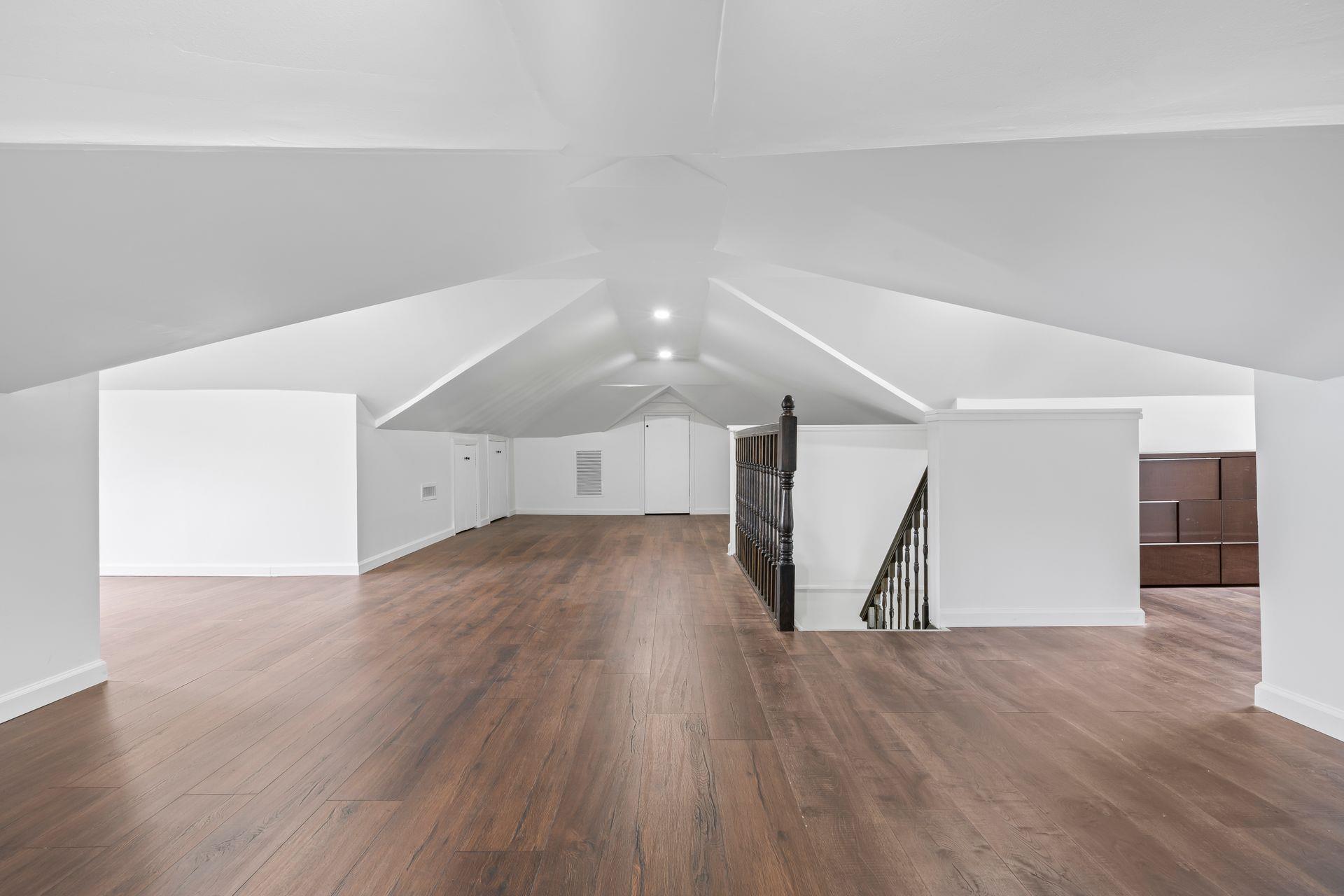 63-41 252nd Street Queens, NY 11362 - Photo 30 of 39 a view of empty room with wooden floor