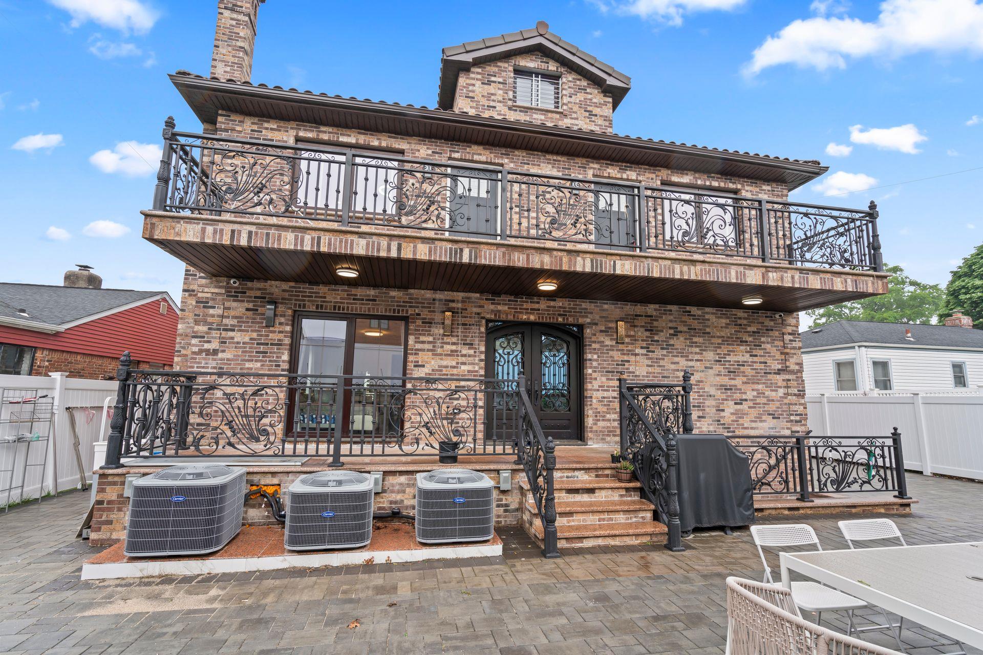 63-41 252nd Street Queens, NY 11362 - Photo 33 of 39 a view of a house with a large windows