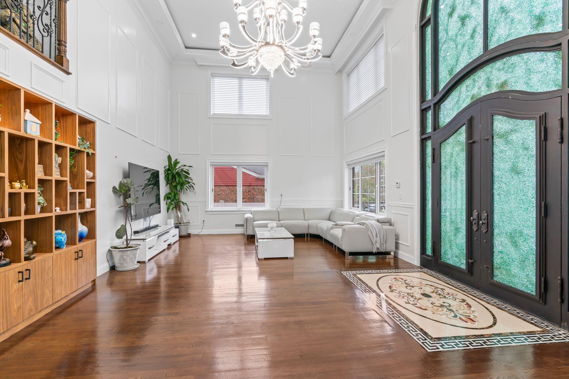 63-41 252nd Street Queens, NY 11362 - Photo 4 of 39 a living room with furniture and a large window