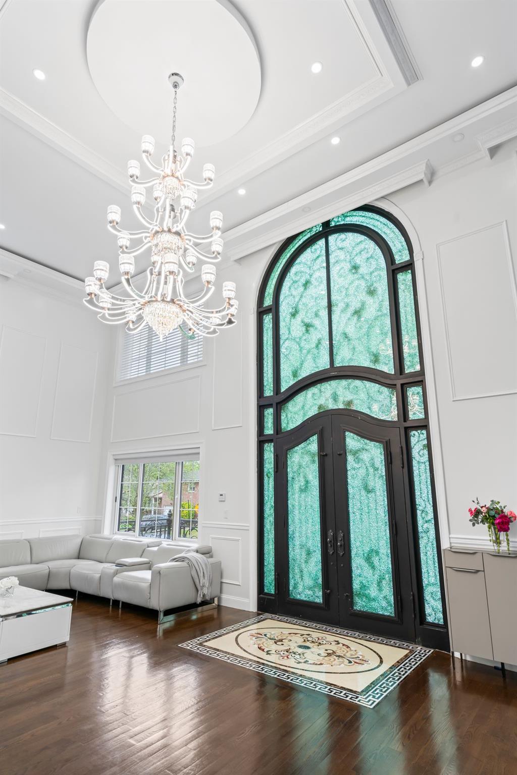 63-41 252nd Street Queens, NY 11362 - Photo 6 of 39 a living room with furniture and a chandelier