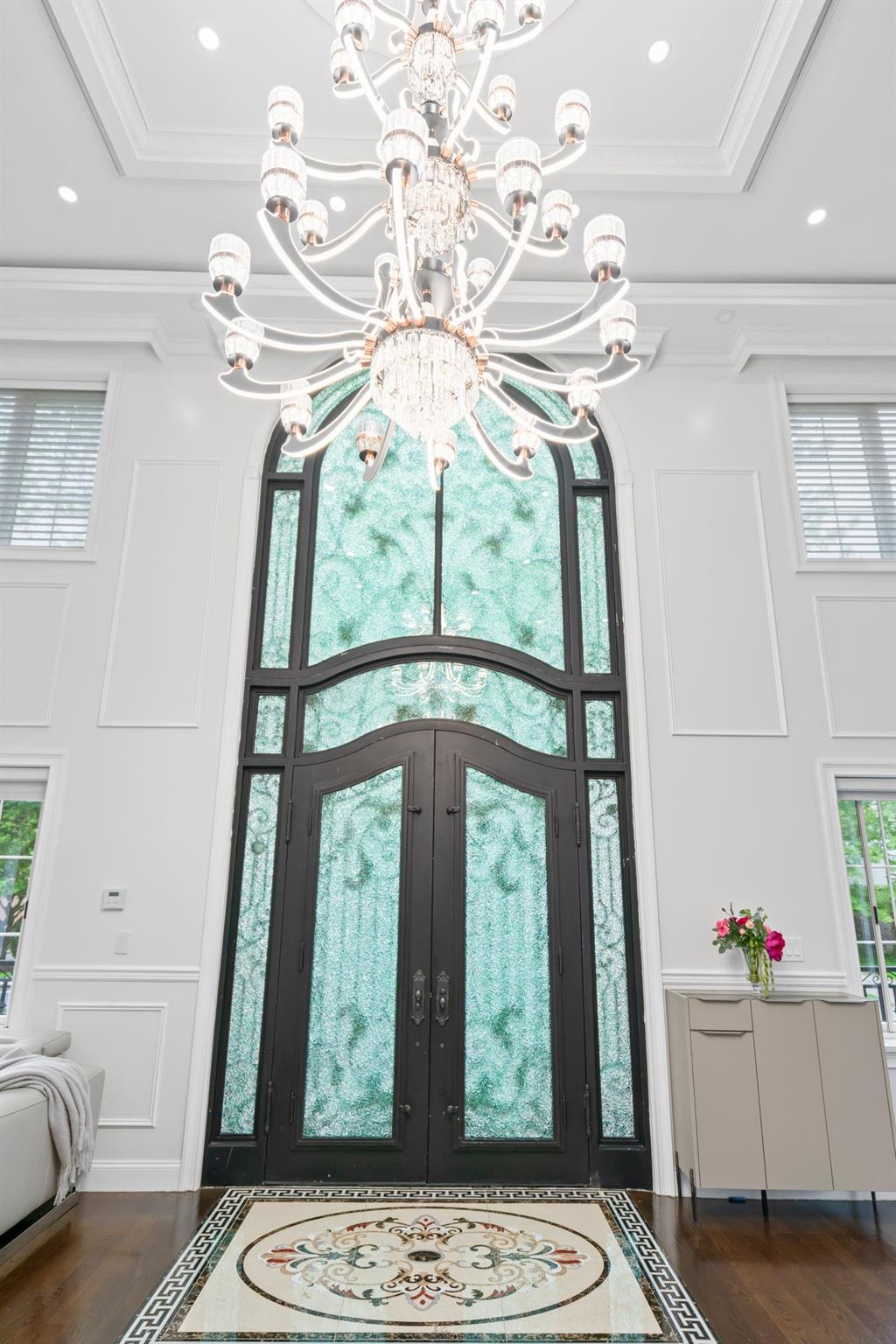 63-41 252nd Street Queens, NY 11362 - Photo 7 of 39 a view of a hallway with furniture and a chandelier