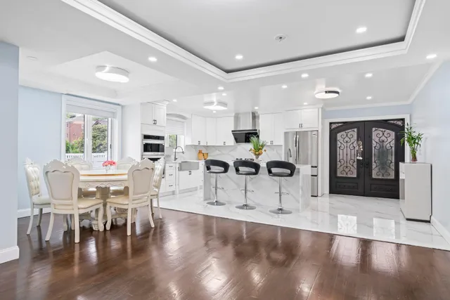 a view of a dining area with furniture and a table