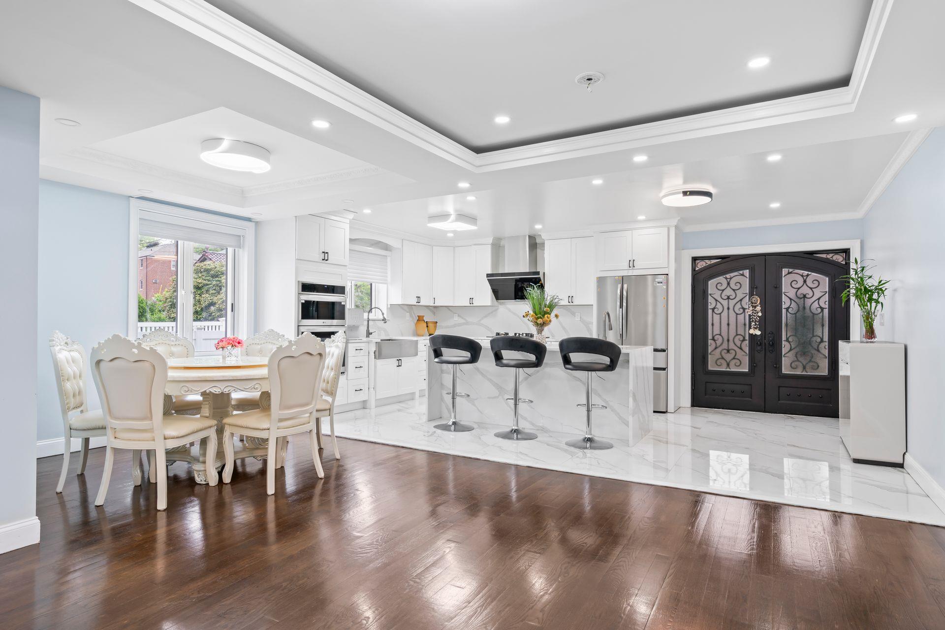 63-41 252nd Street Queens, NY 11362 - Photo 9 of 39 a view of a dining room with furniture and wooden floor