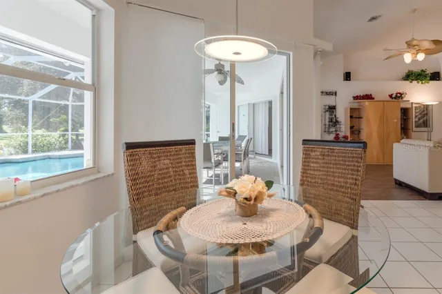 a dining room with furniture and wooden floor
