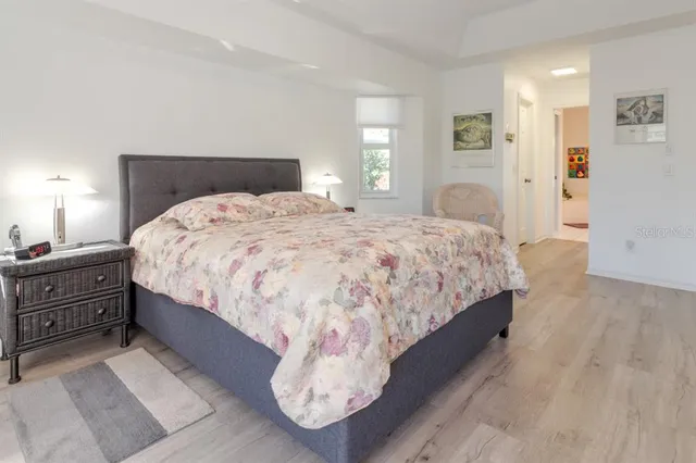 a bedroom with bed and window