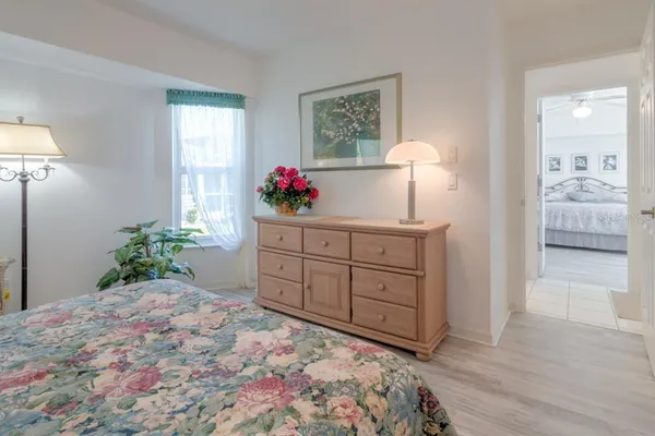 a bedroom with a bed and a dresser in it