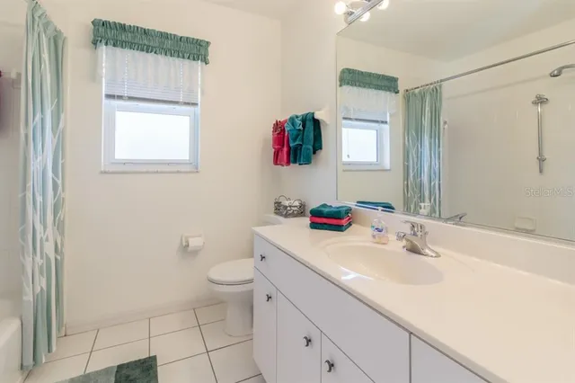 a bathroom with a sink toilet and vanity
