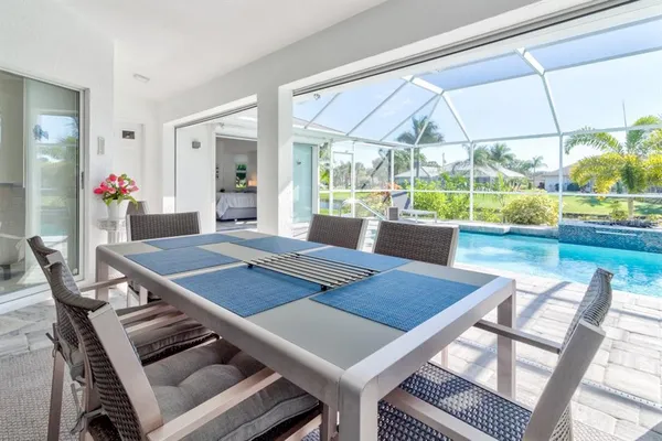 a view of a dining room with furniture window and outside view