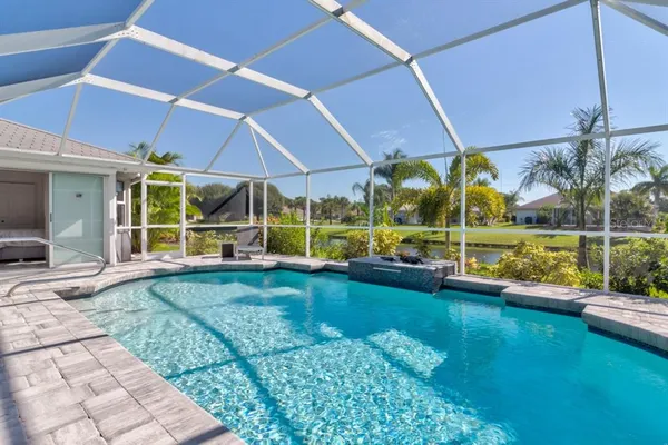 a view of a swimming pool with a patio