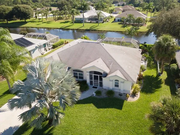 an aerial view of a house with a lake view