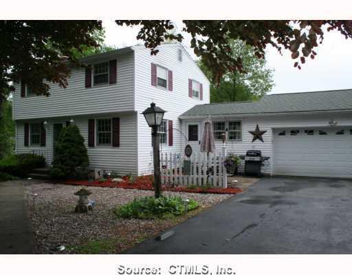 153 Old Willimantic Road Columbia, CT 06237 - Photo 1 of 1 a view of a house with a patio