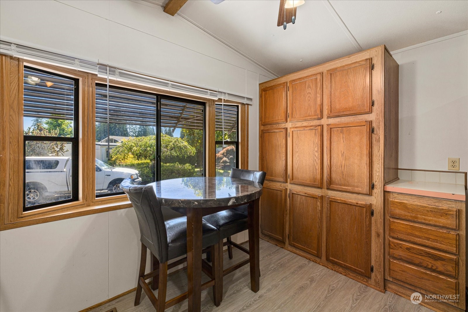 2302 R Street Southeast, Unit 46 Auburn, WA 98002 - Photo 12 of 25 a dining room with furniture window and wooden floor