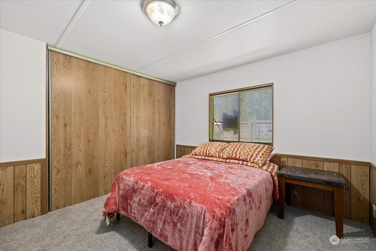 2302 R Street Southeast, Unit 46 Auburn, WA 98002 - Photo 14 of 25 a bedroom with a bed and a window