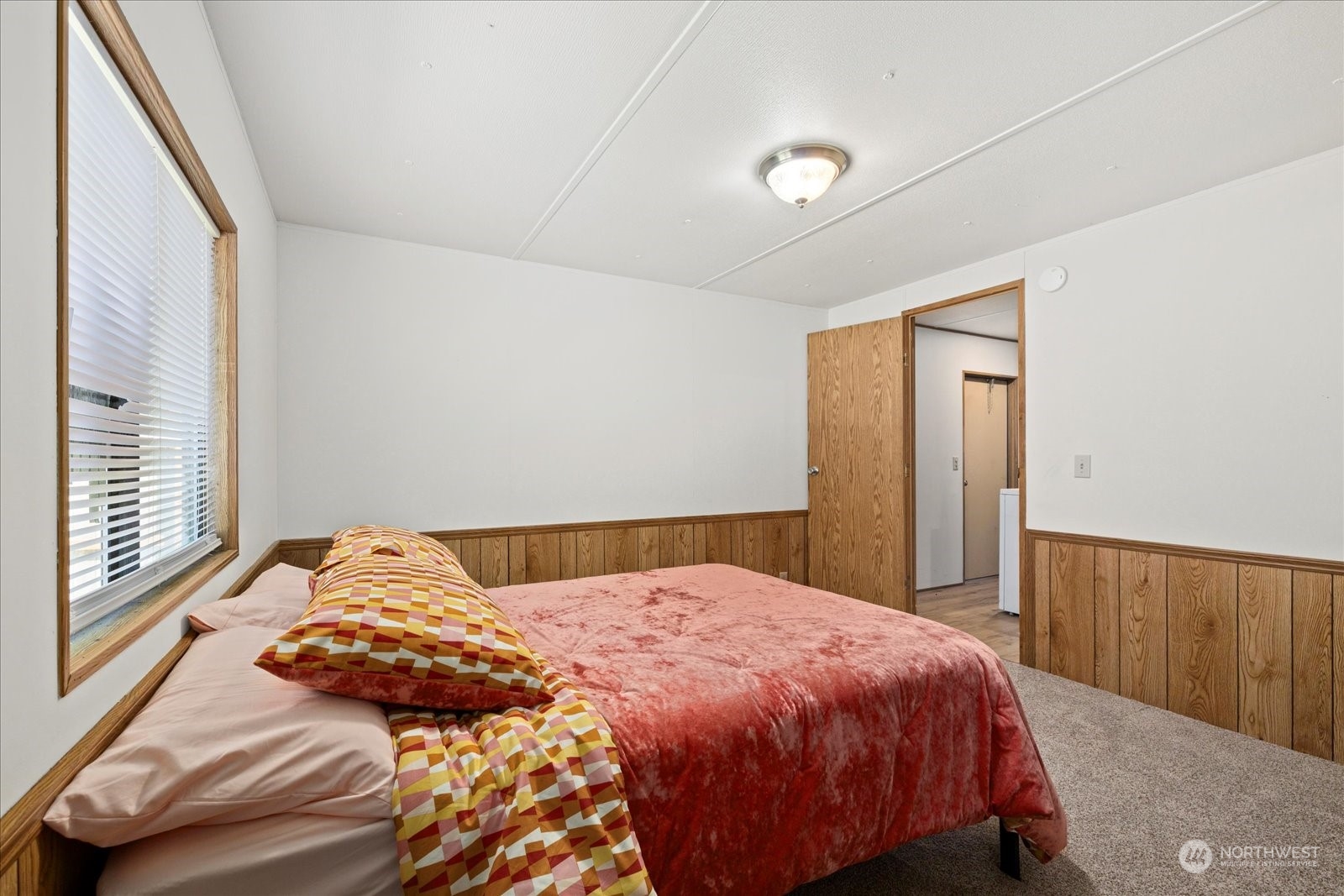 2302 R Street Southeast, Unit 46 Auburn, WA 98002 - Photo 15 of 25 a bedroom with a bed and a window