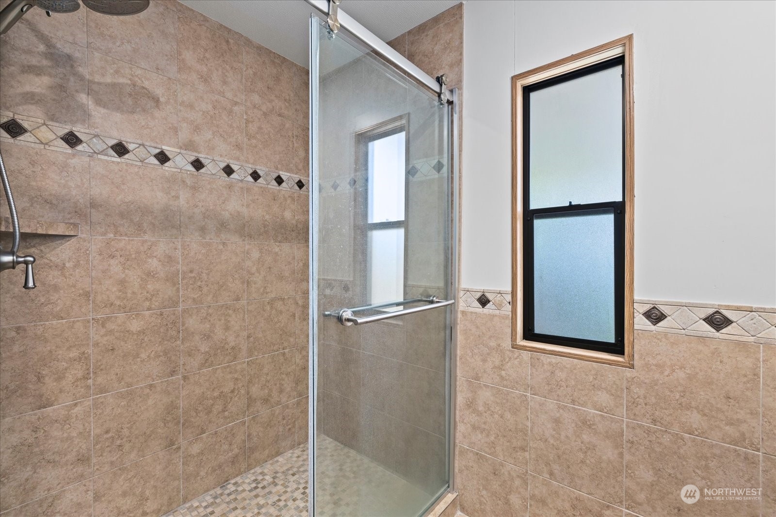 2302 R Street Southeast, Unit 46 Auburn, WA 98002 - Photo 16 of 25 a bathroom with a glass shower door