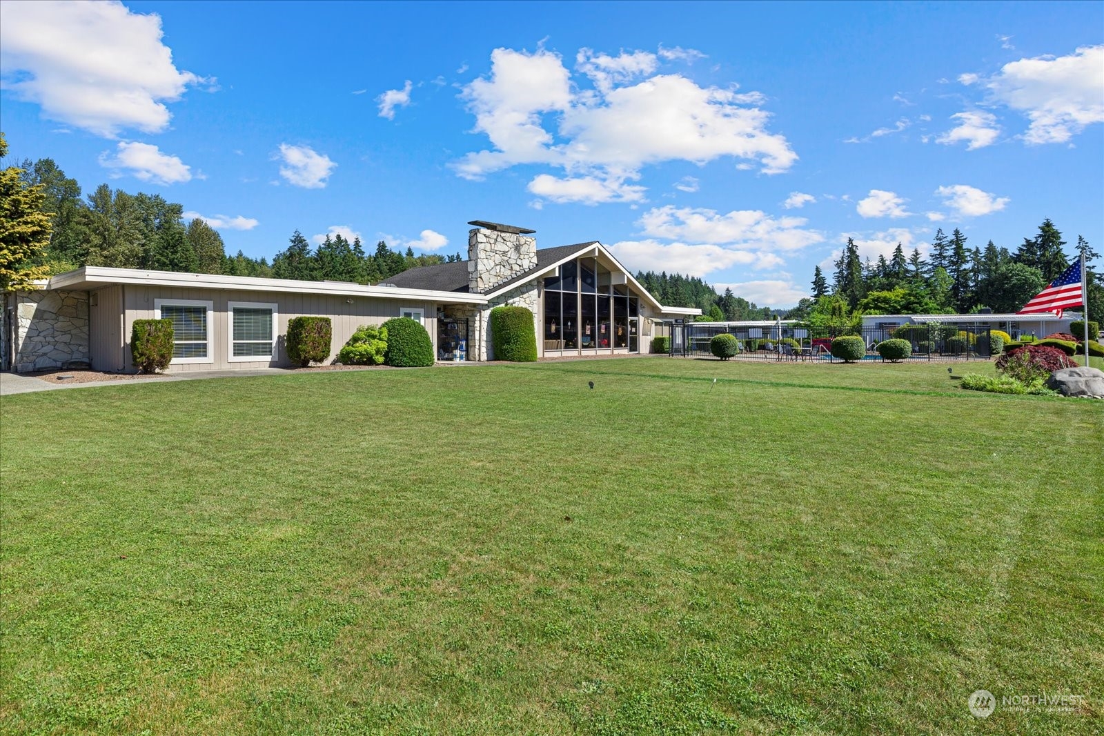 2302 R Street Southeast, Unit 46 Auburn, WA 98002 - Photo 23 of 25 a view of a house with a yard