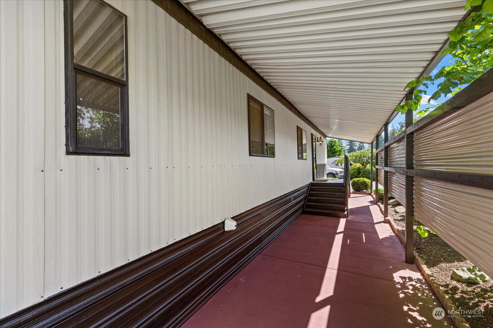 2302 R Street Southeast, Unit 46 Auburn, WA 98002 - Photo 4 of 25 a porch with wooden floor