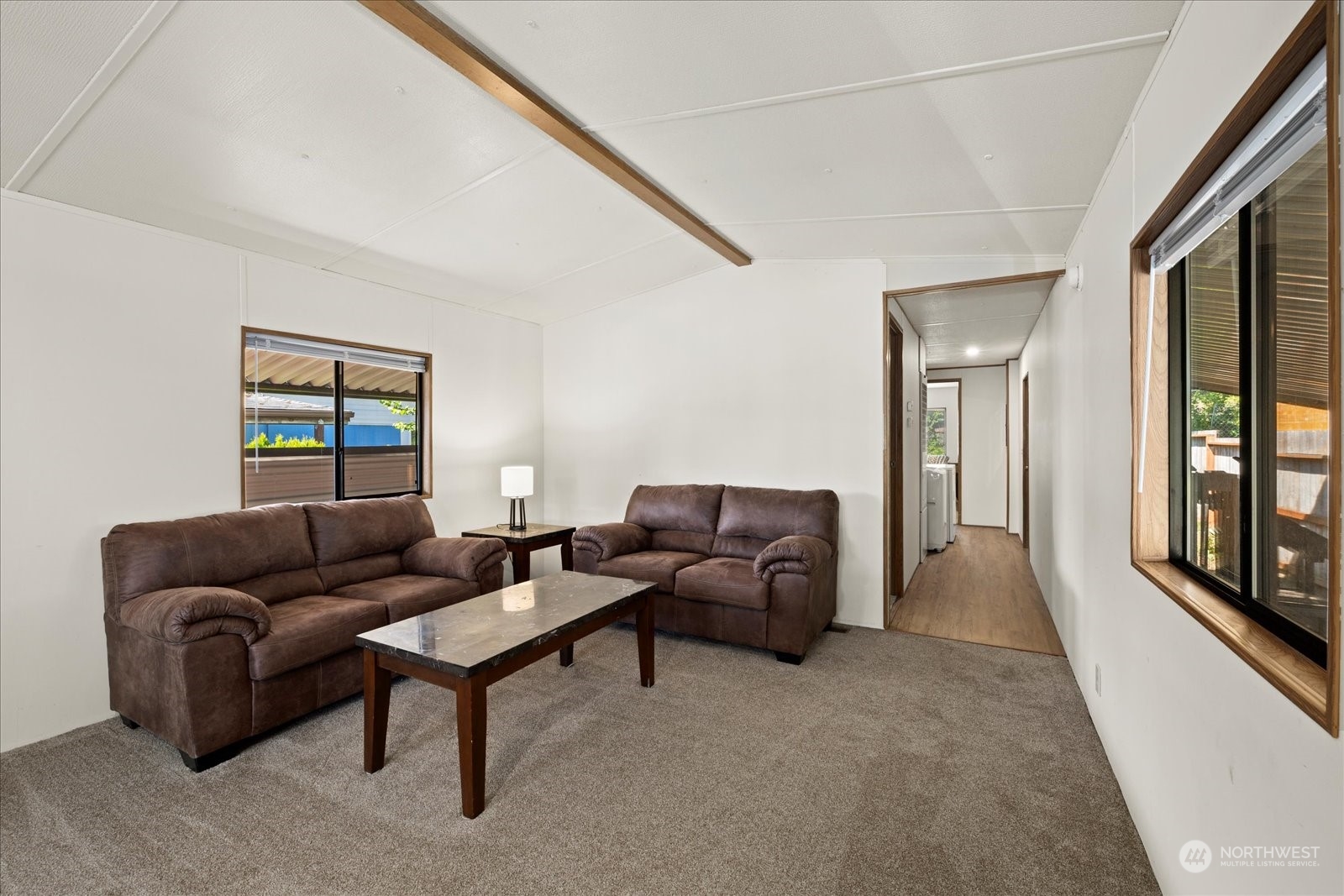 2302 R Street Southeast, Unit 46 Auburn, WA 98002 - Photo 7 of 25 a living room with furniture and a window