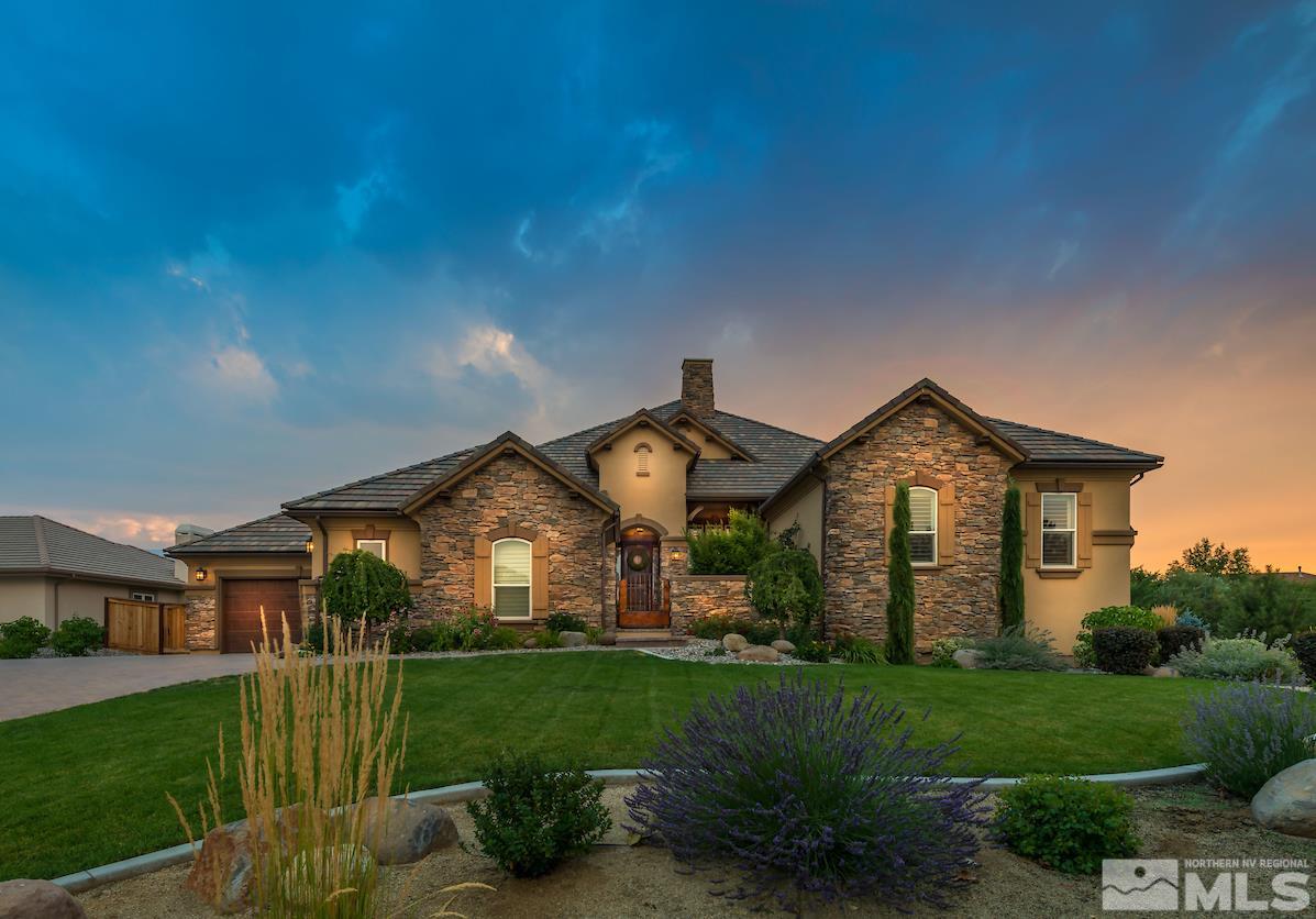 12745 Silver Wolf Road Reno, NV 89511 - Photo 1 of 21 a front view of a house with a yard and garage