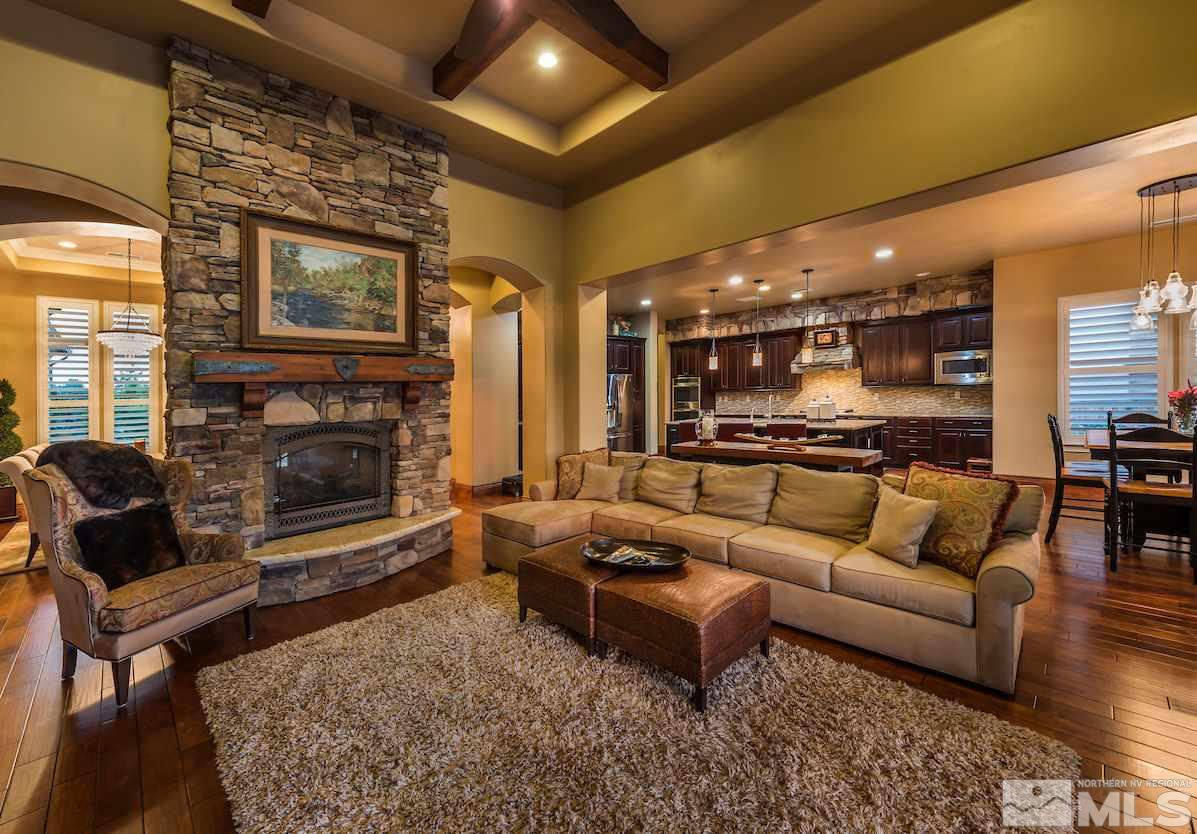 12745 Silver Wolf Road Reno, NV 89511 - Photo 3 of 21 a living room with furniture and a fireplace