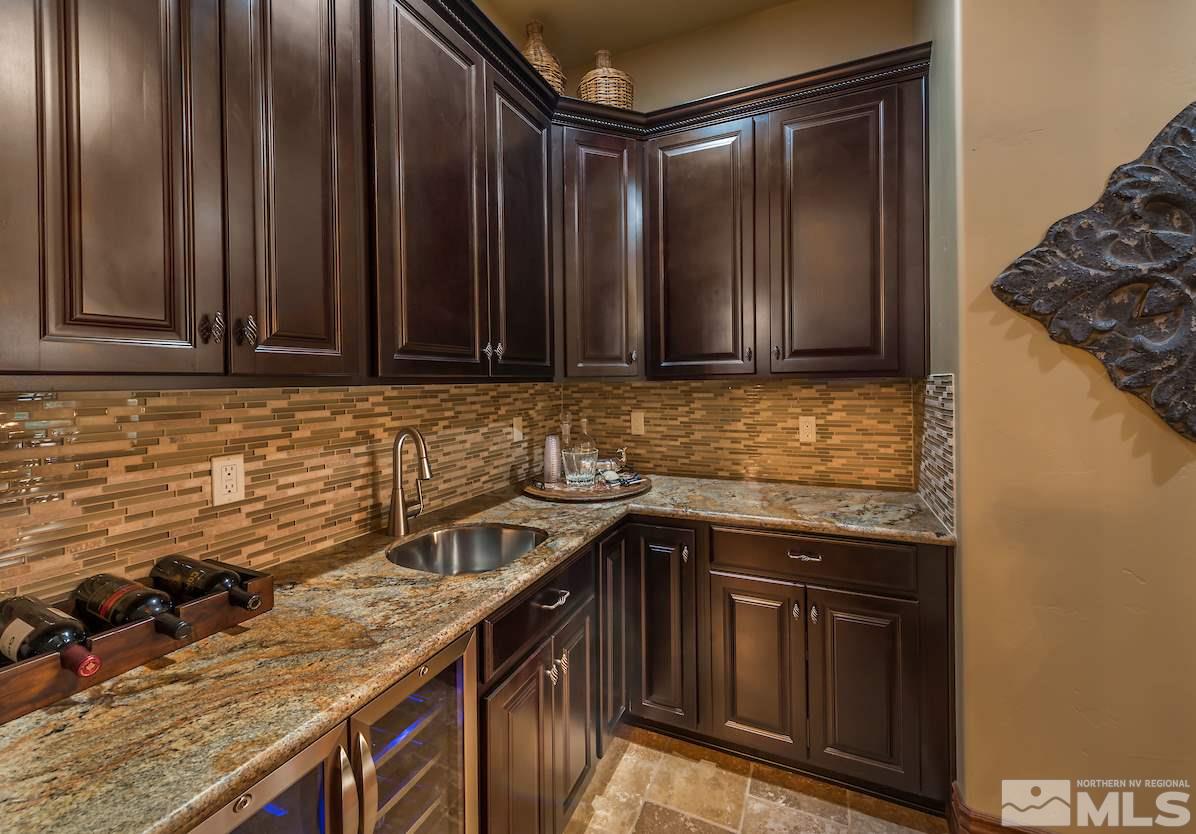 12745 Silver Wolf Road Reno, NV 89511 - Photo 6 of 21 a kitchen that has a sink and a stove