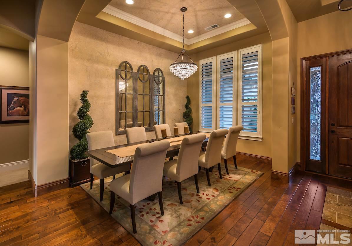 12745 Silver Wolf Road Reno, NV 89511 - Photo 7 of 21 a view of a dining room with furniture window and wooden floor