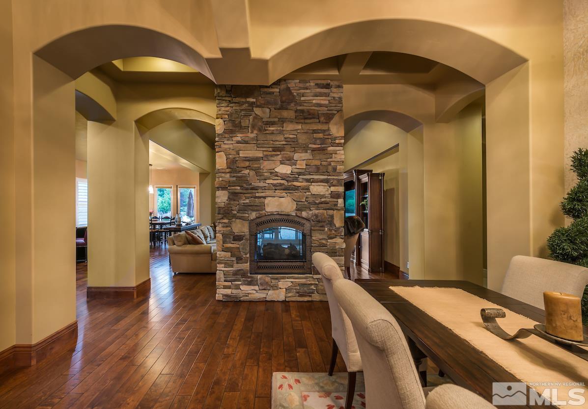 12745 Silver Wolf Road Reno, NV 89511 - Photo 8 of 21 a living room with furniture fireplace and wooden floor