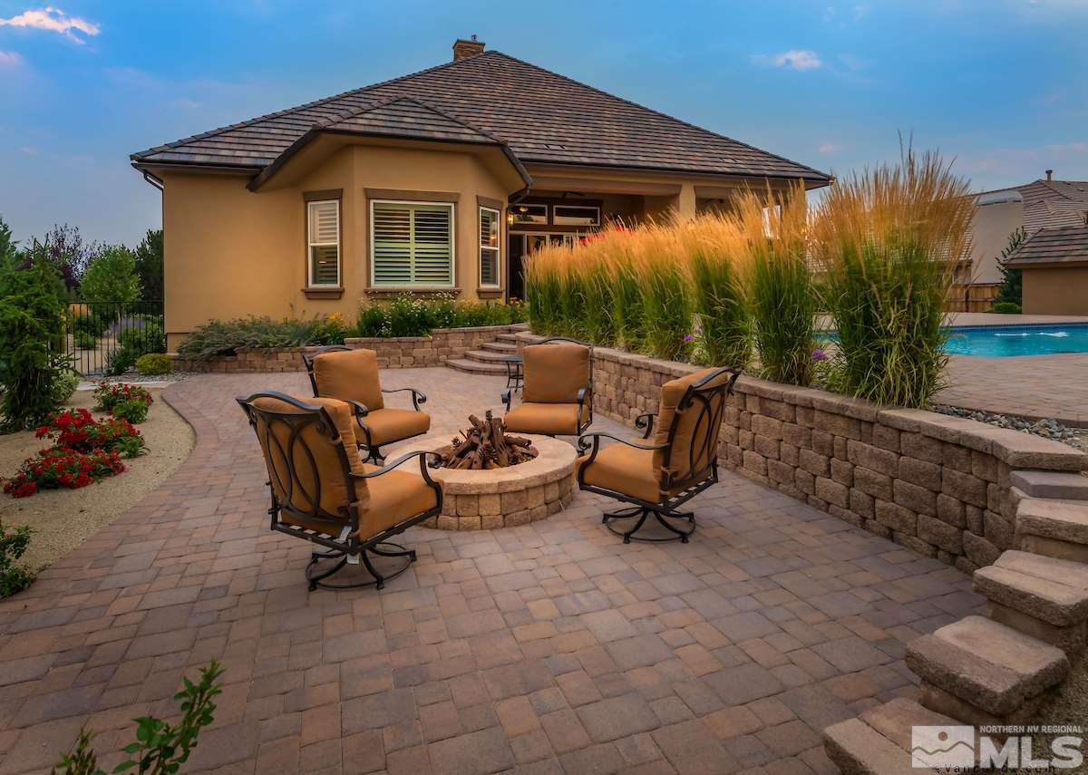 12745 Silver Wolf Road Reno, NV 89511 - Photo 10 of 21 a view of a backyard with a table and chairs