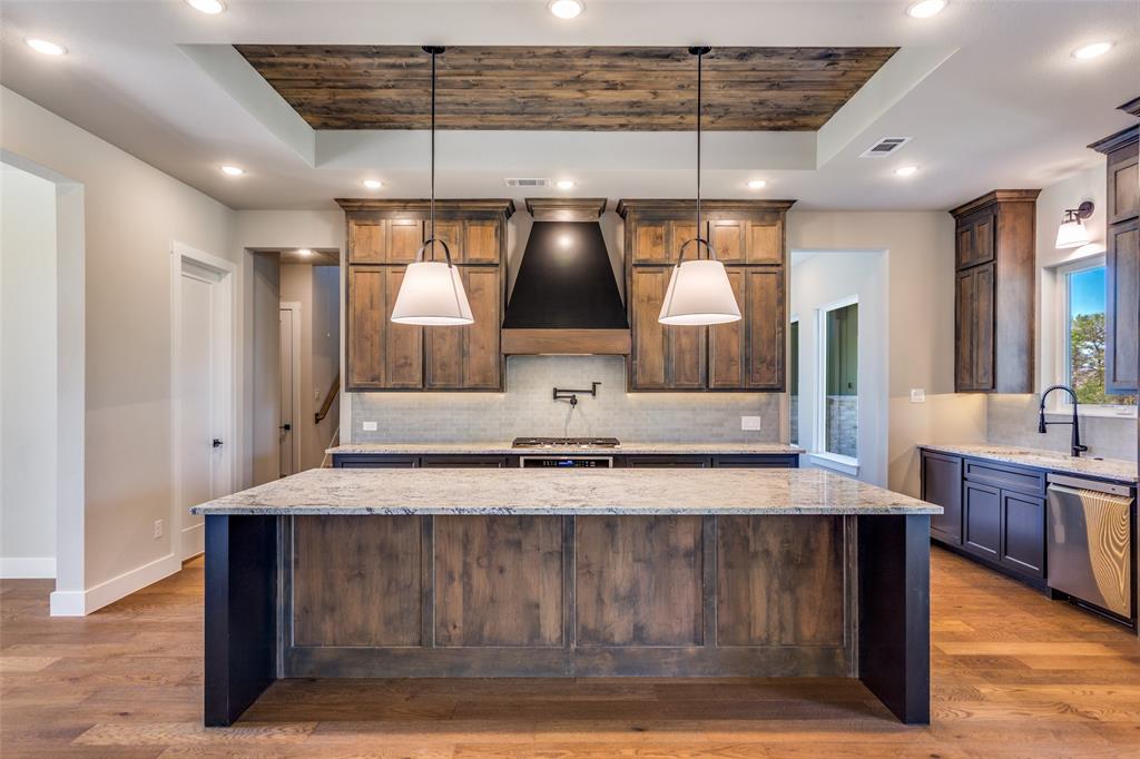 555 Aermotor Loop Weatherford, TX 76085 - Photo 11 of 30 a room with kitchen countertops and wooden floor