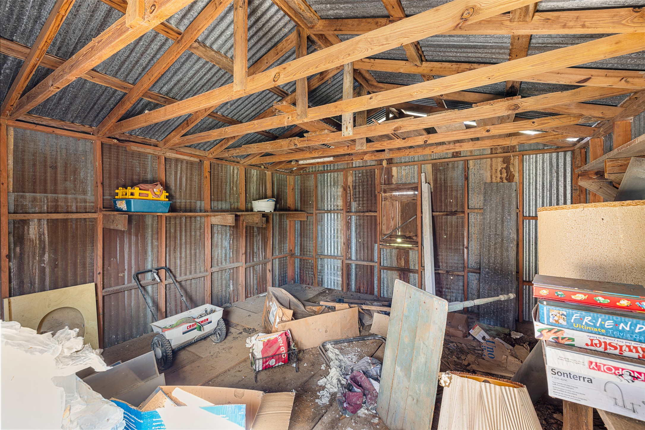 809 Main Street Lexington, TX 78947 - Photo 23 of 23 a view of a deck with couches chairs and wooden floor
