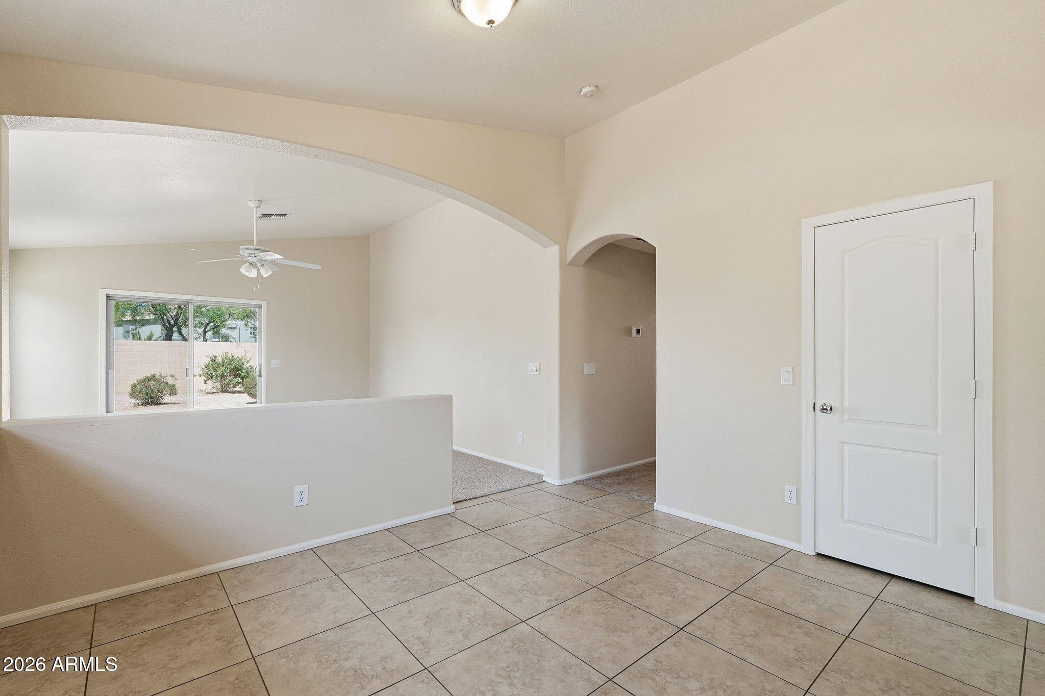 2022 South 160th Lane Goodyear, AZ 85338 - Photo 15 of 36 an empty room with kitchen view and windows