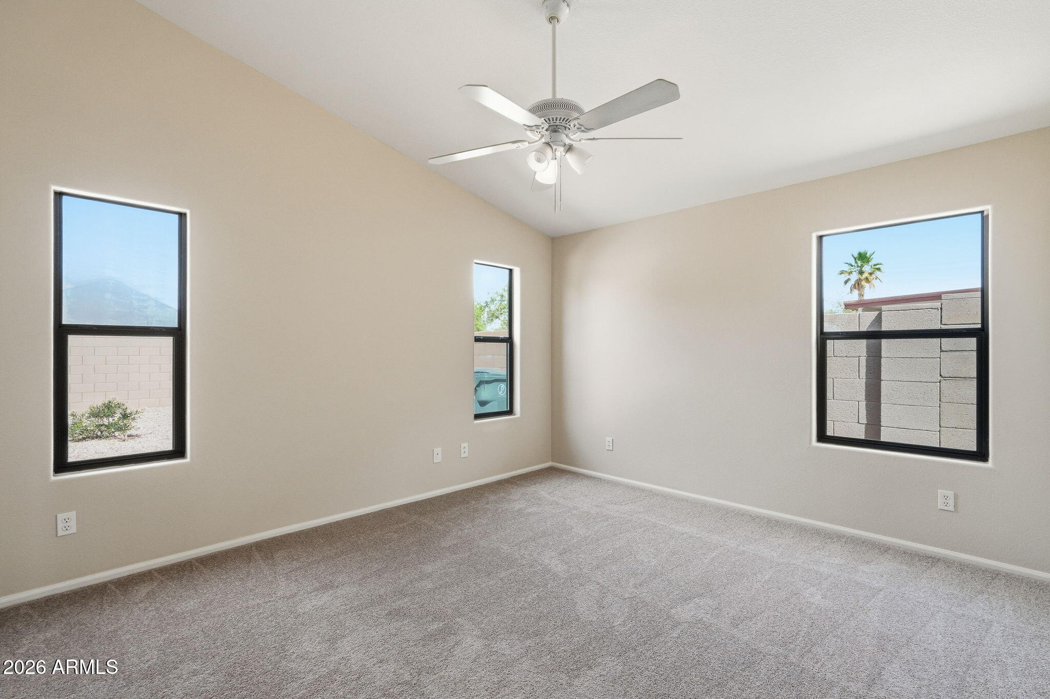 2022 South 160th Lane Goodyear, AZ 85338 - Photo 16 of 36 an empty room with windows and fan