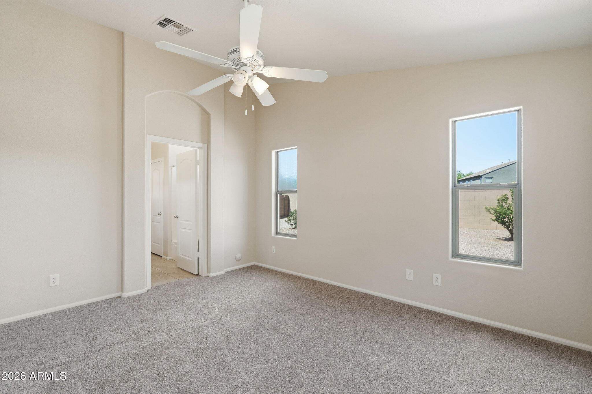 2022 South 160th Lane Goodyear, AZ 85338 - Photo 17 of 36 an empty room with windows and fan