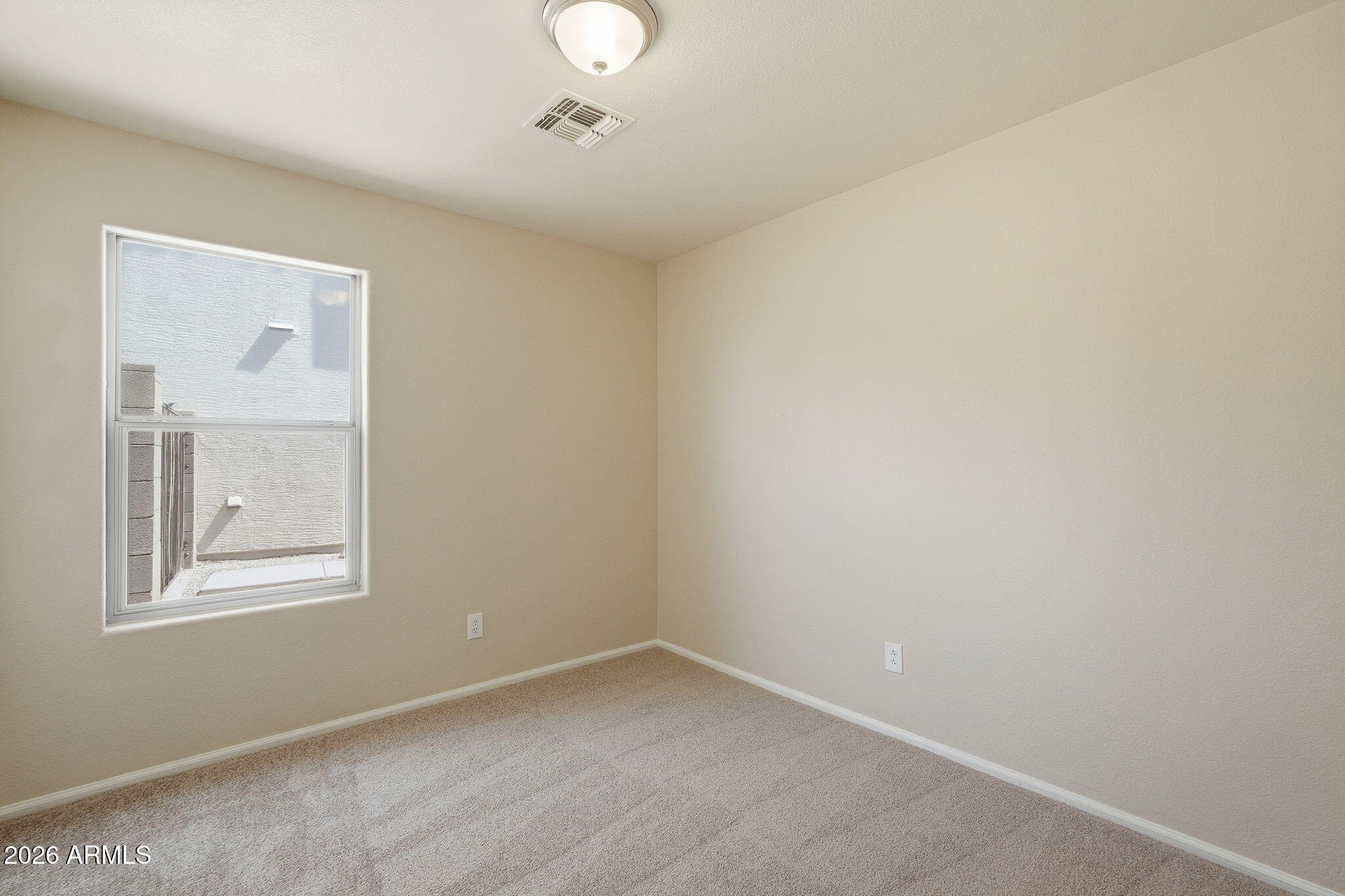 2022 South 160th Lane Goodyear, AZ 85338 - Photo 22 of 36 an empty room with windows and closet