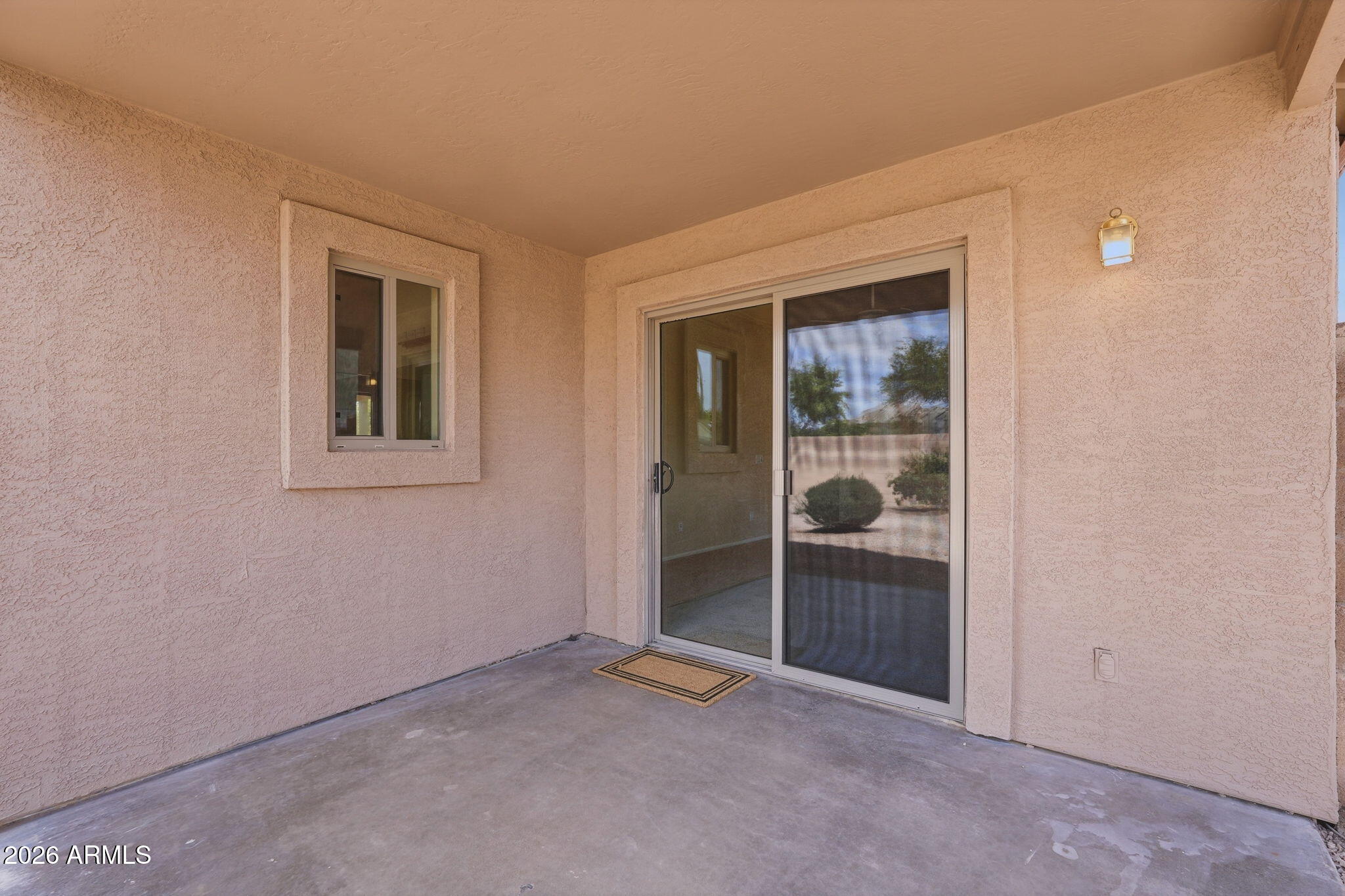 2022 South 160th Lane Goodyear, AZ 85338 - Photo 31 of 36 an empty room with glass door