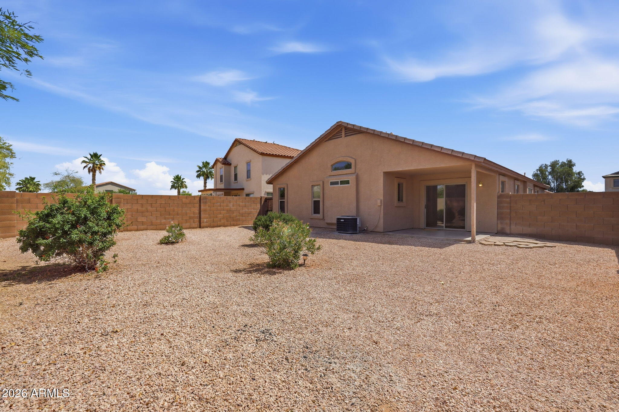 2022 South 160th Lane Goodyear, AZ 85338 - Photo 33 of 36 a front view of a house with a yard and garage