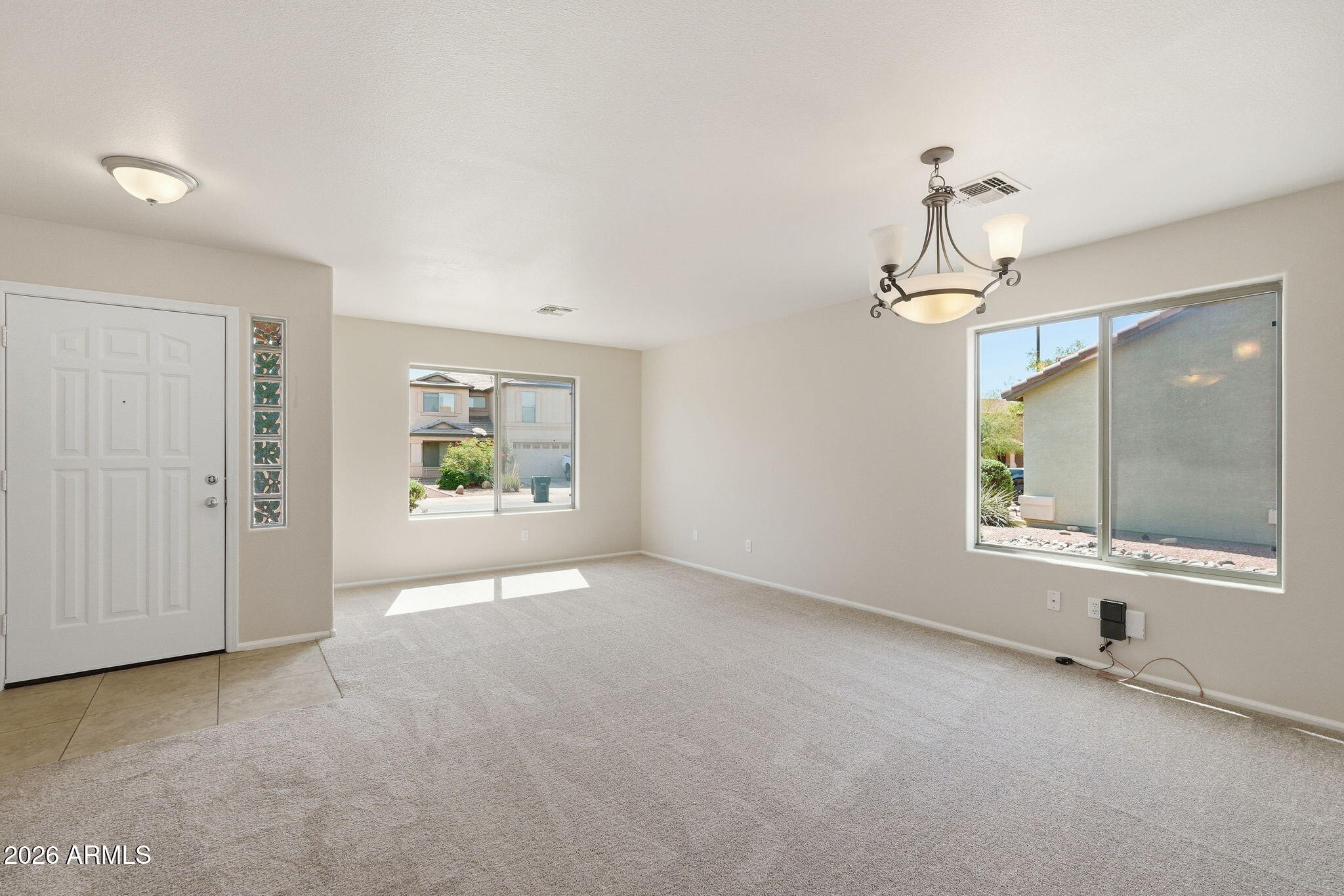 2022 South 160th Lane Goodyear, AZ 85338 - Photo 6 of 36 en empty room with window and mirror