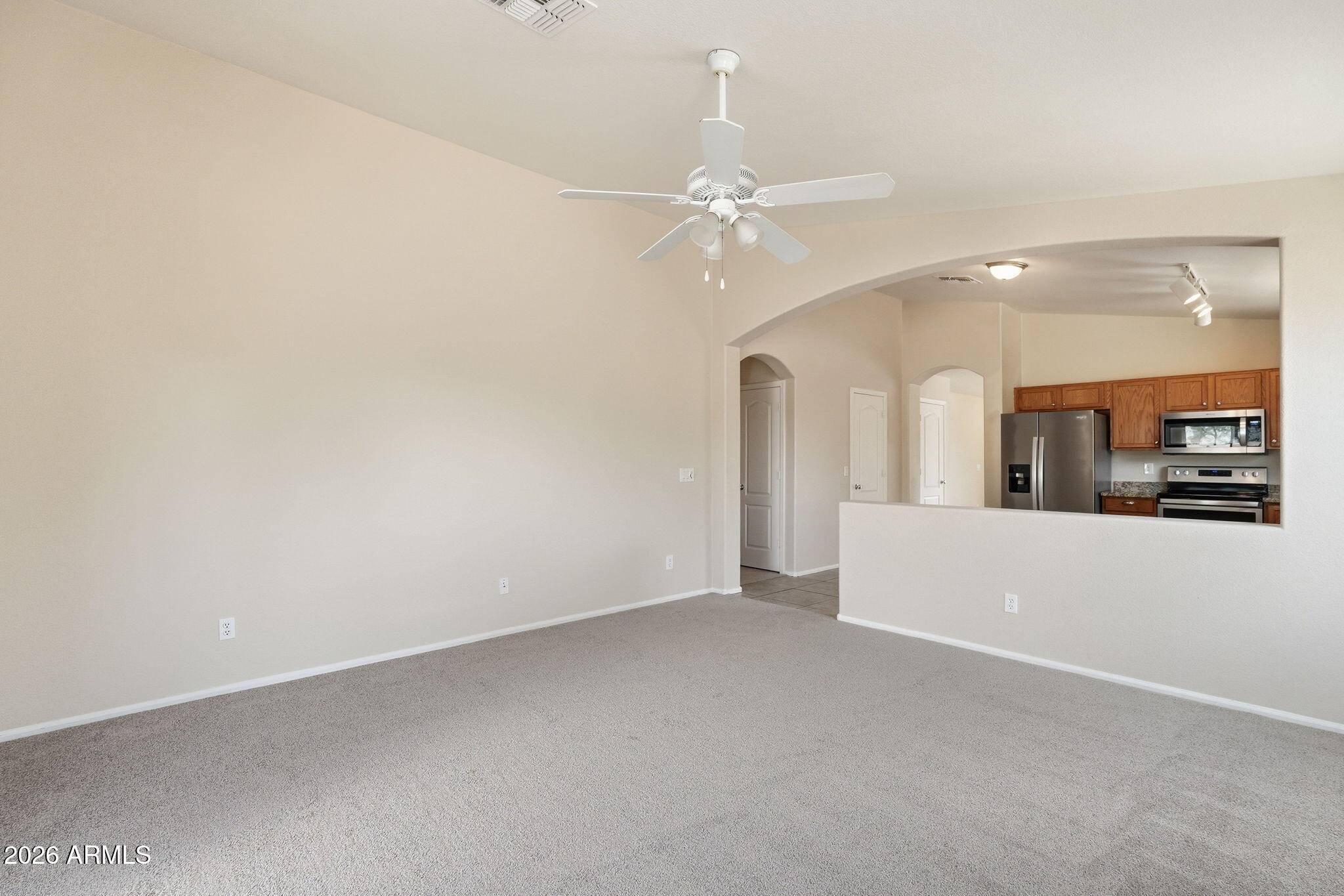 2022 South 160th Lane Goodyear, AZ 85338 - Photo 9 of 36 an empty room with fan