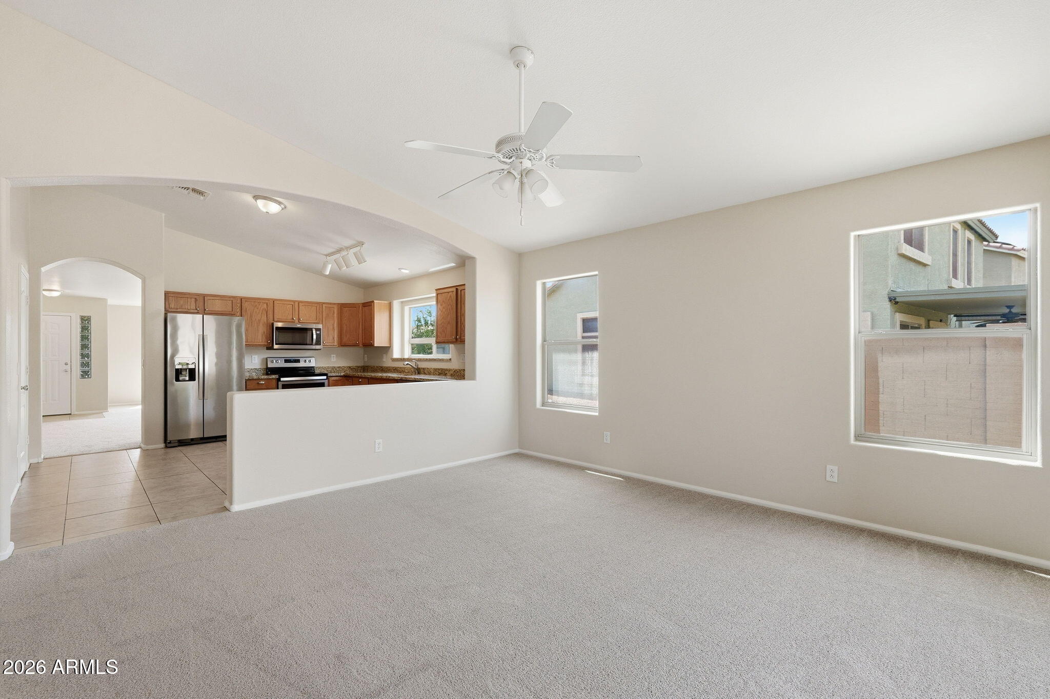 2022 South 160th Lane Goodyear, AZ 85338 - Photo 10 of 36 a view of a kitchen and a kitchen with furniture and a kitchen