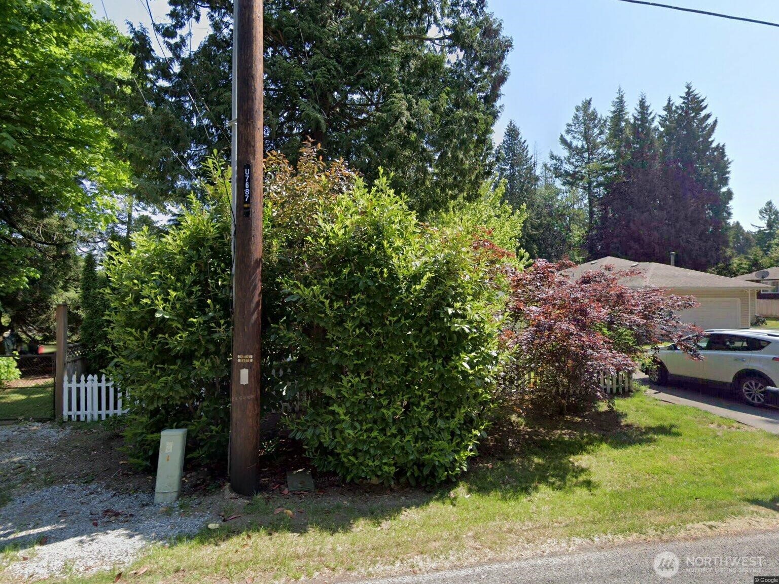 266 Boundary Bay Road Point Roberts, WA 98281 - Photo 1 of 1 a view of a garden with a tree
