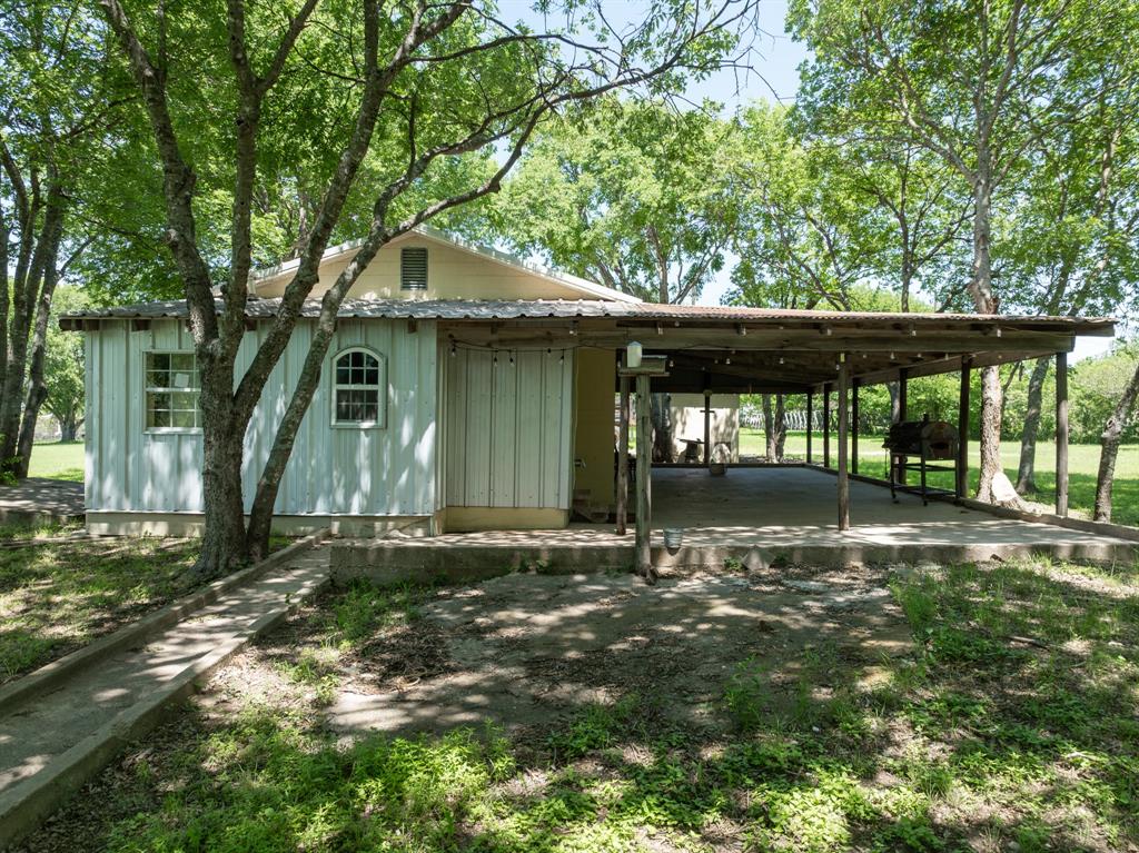 1355 North Houston Street Lorena, TX 76655 - Photo 12 of 40 a backyard of a house with table and chairs