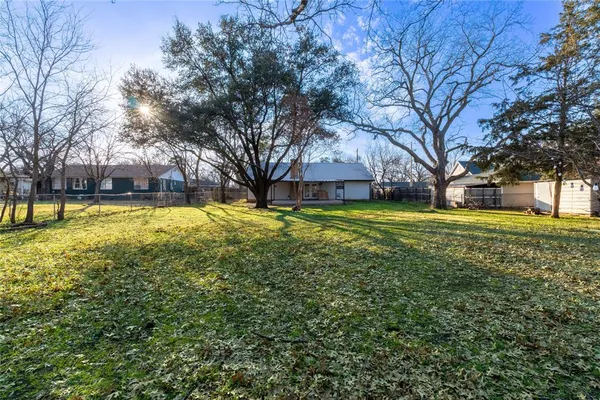 a view of a house with a large trees