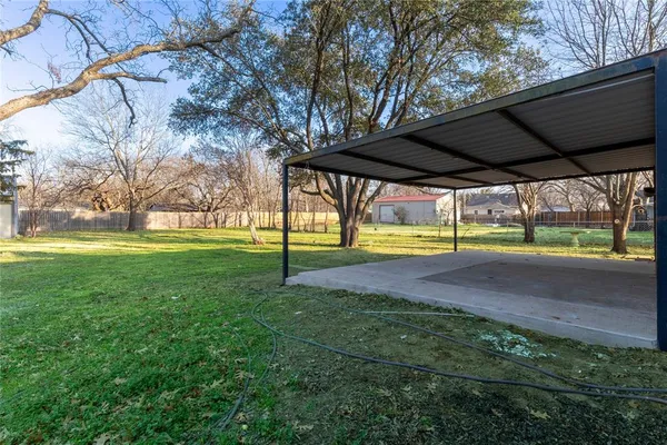 a view of yard with tree and green space