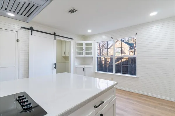 a view of kitchen and windows